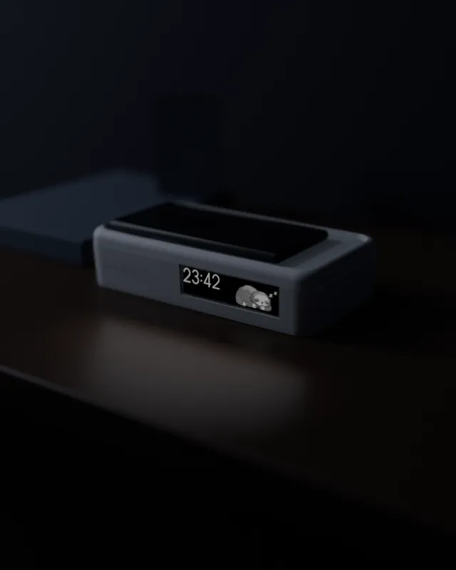 Design render: the Snubblz dock at night, the sloth asleep on its screen